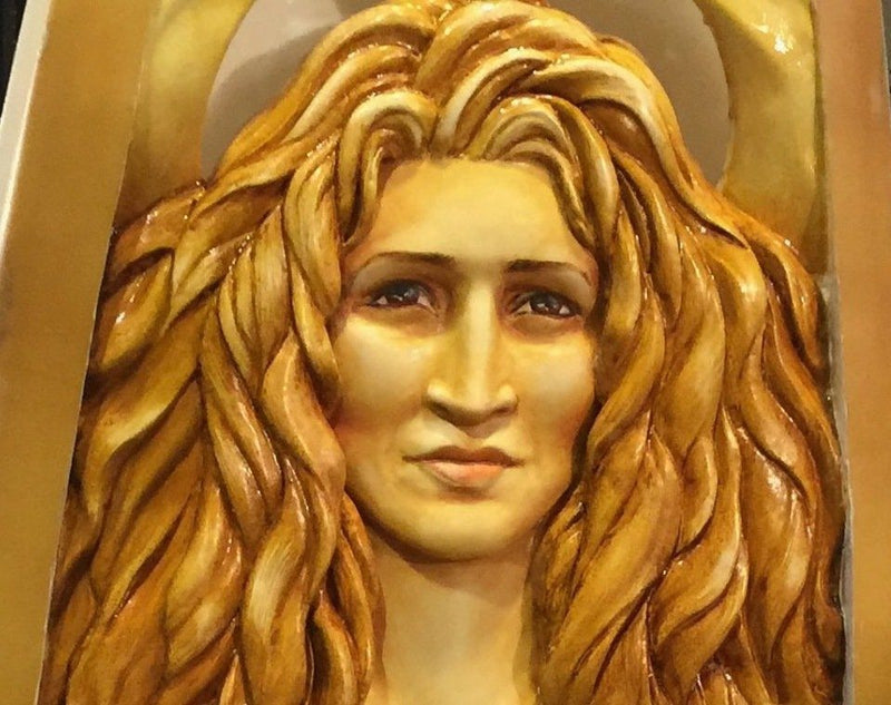 Serene, carved surfboard portrait