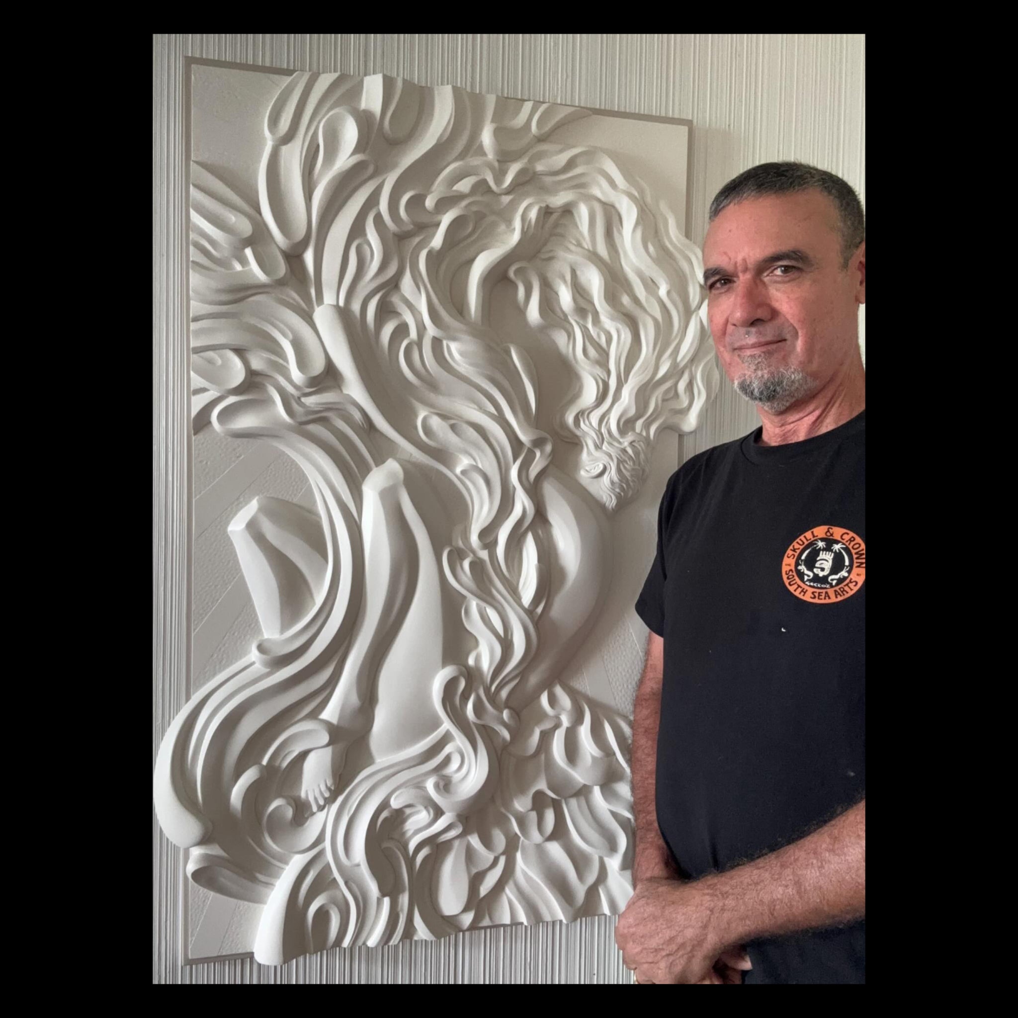 Hawaiian artist Ruben Aira Jr's "Awakening" a Hand carved art piece.